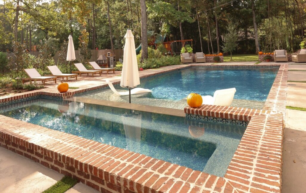 Geometric Pool with Sunshelf in Benders Landing Estates of Spring, Texas