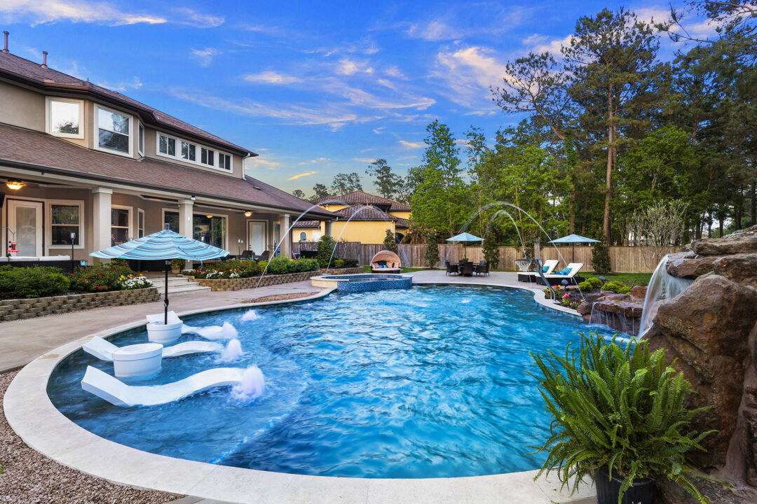 Freeform Pool with Slide and Grotto in Benders Landing Estates of Spring, Texas