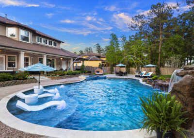 Freeform Pool with Slide and Grotto in Benders Landing Estates of Spring, Texas