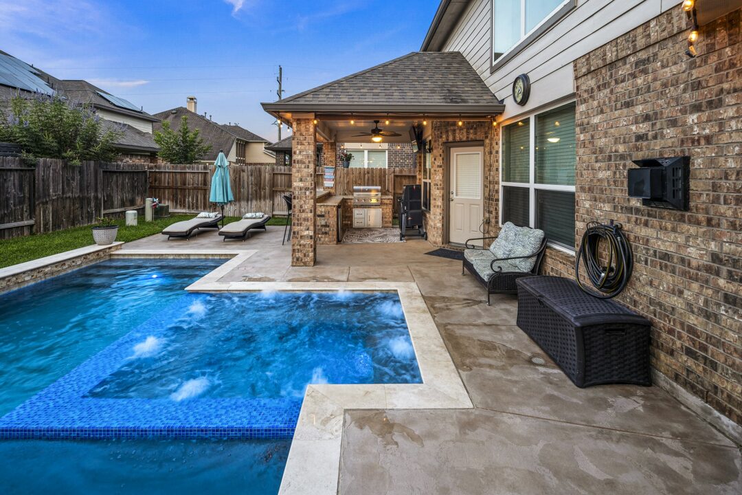 Geometric Pool and Granite Outdoor Kitchen in Cypress, Texas