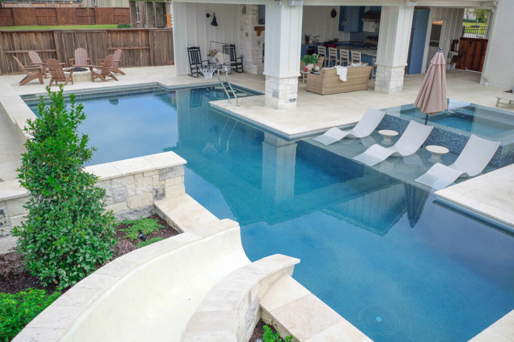 Geometric Pool, Outdoor Kitchen, and Outdoor Living Space in Spring, Texas