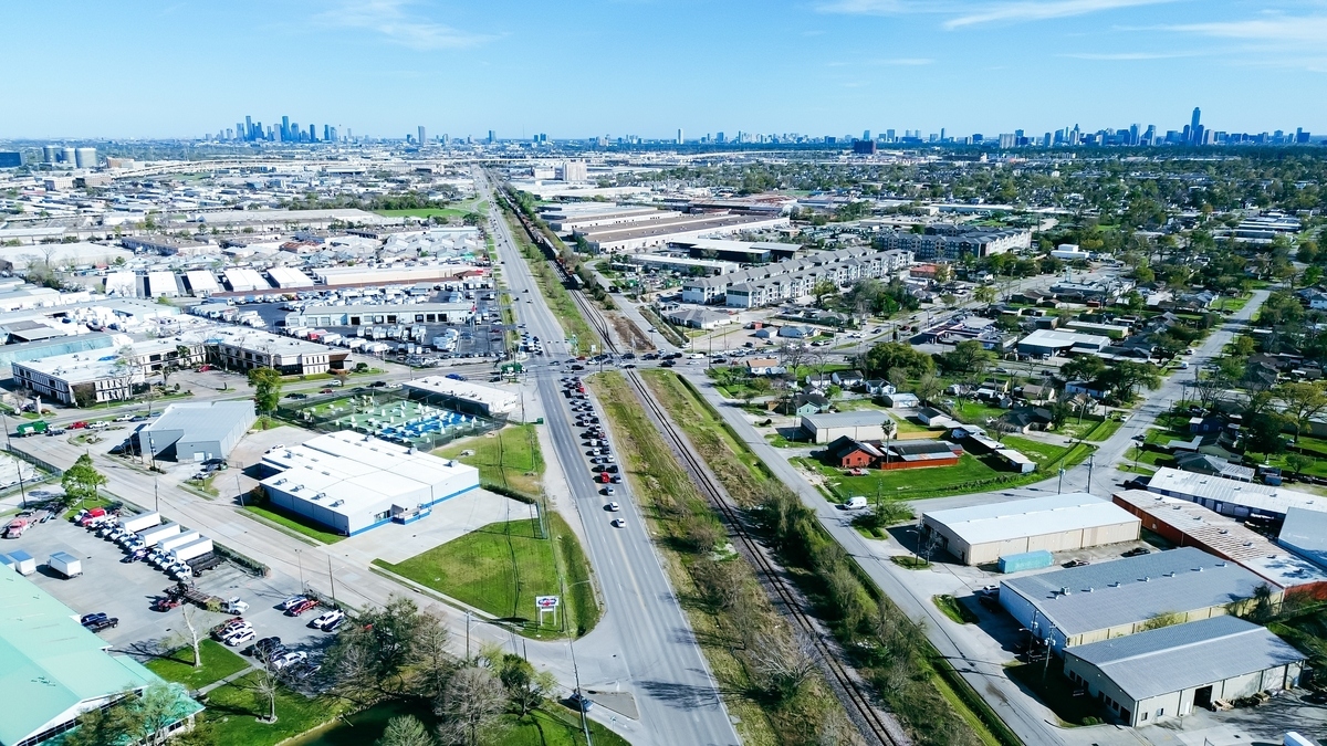 Hempstead,Railroad,With,Downtown,Houston,Skyline,Background,,Industrial,Park,In